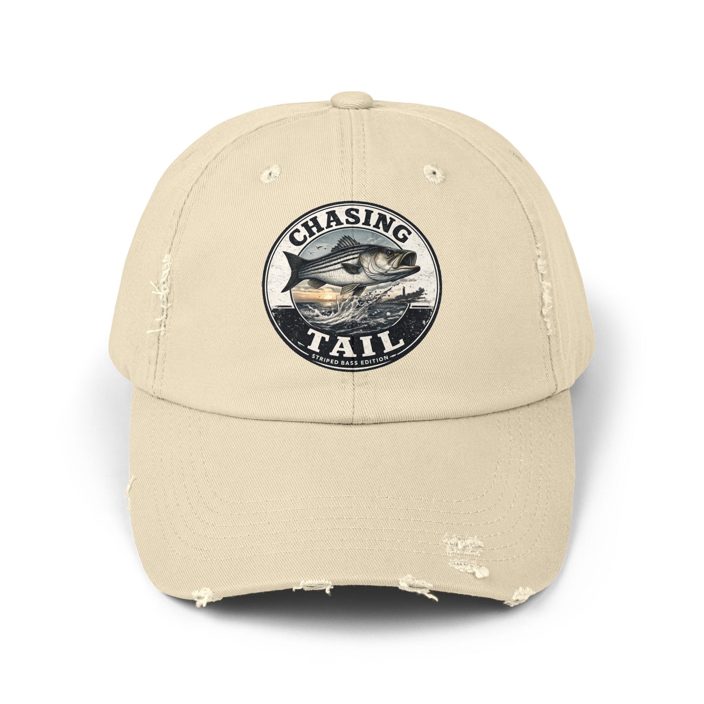 A beige distressed baseball cap featuring a circular embroidered patch on the front with a fish and the text 'CHASING TAIL'.